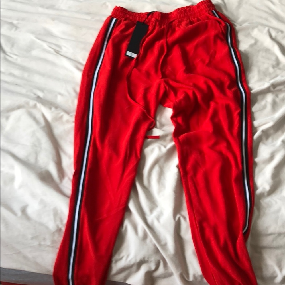 Red pants with black and white strips